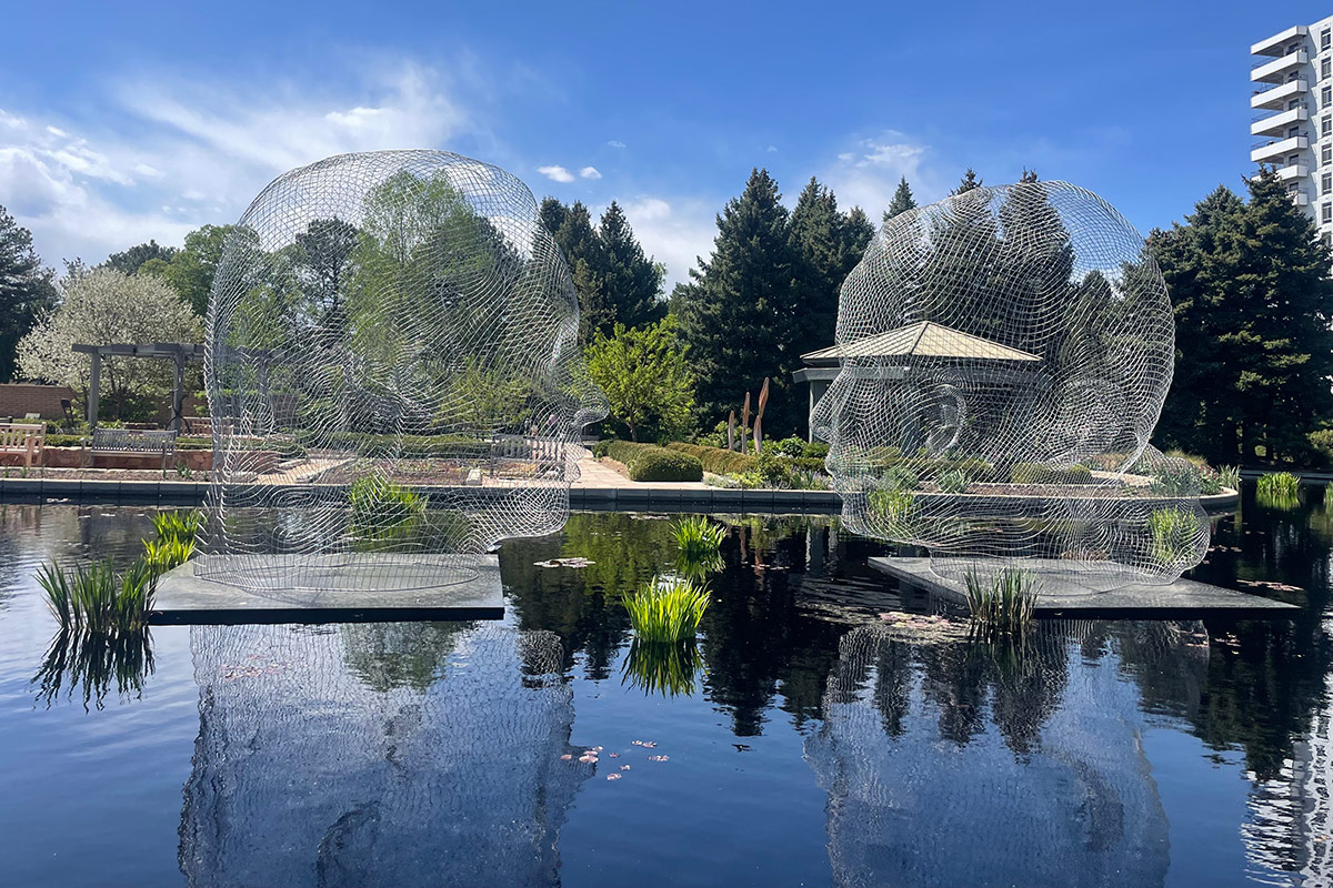 metal sculpture above pond at Denver Botanic Garden