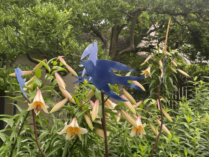 Garden ornament near blooms