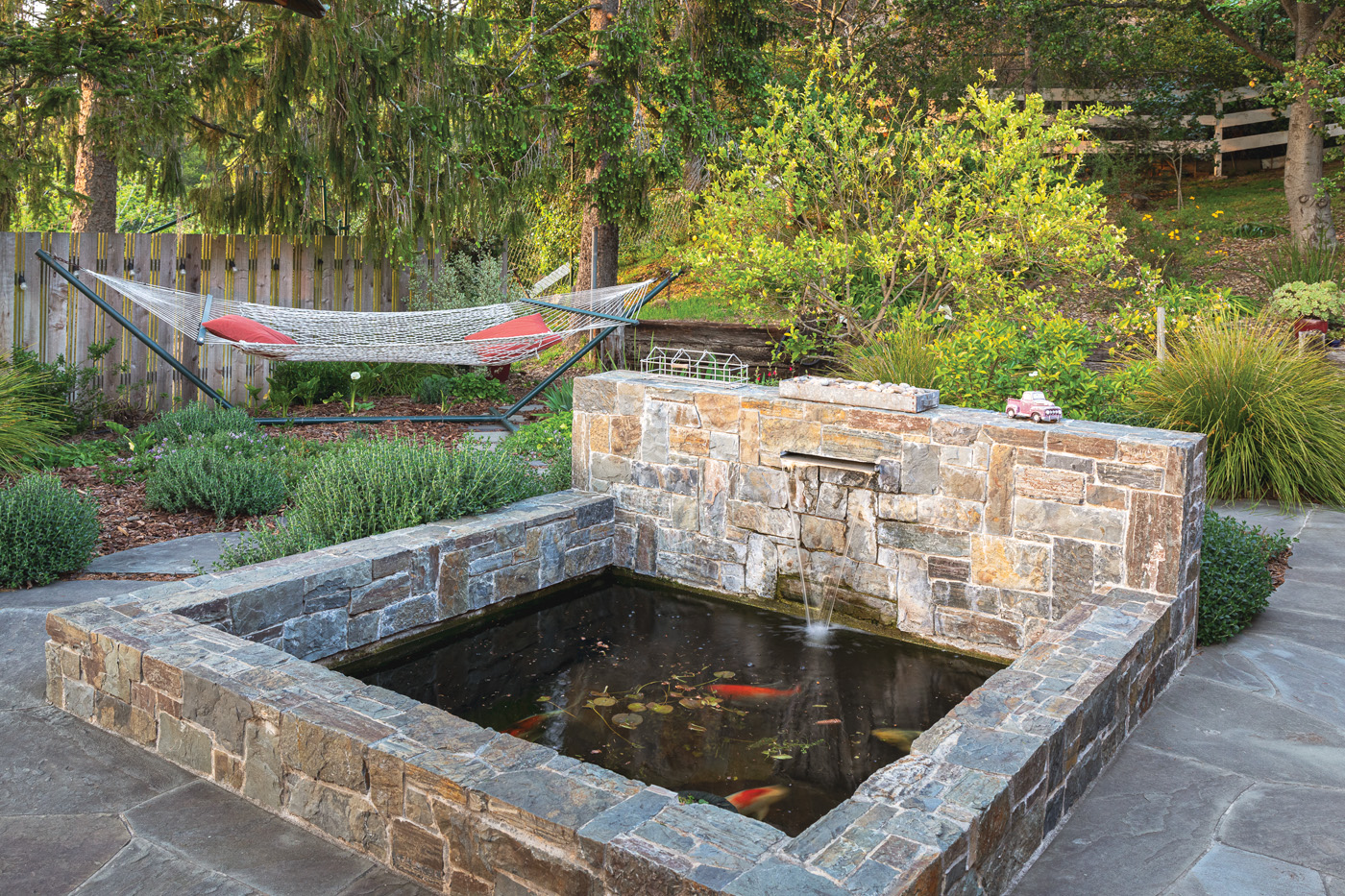 Stone Koi pond with hammock