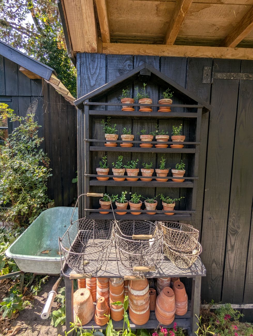 terracotta pots, baskets, potting area, garden workspace, container gardening, Dutch garden
