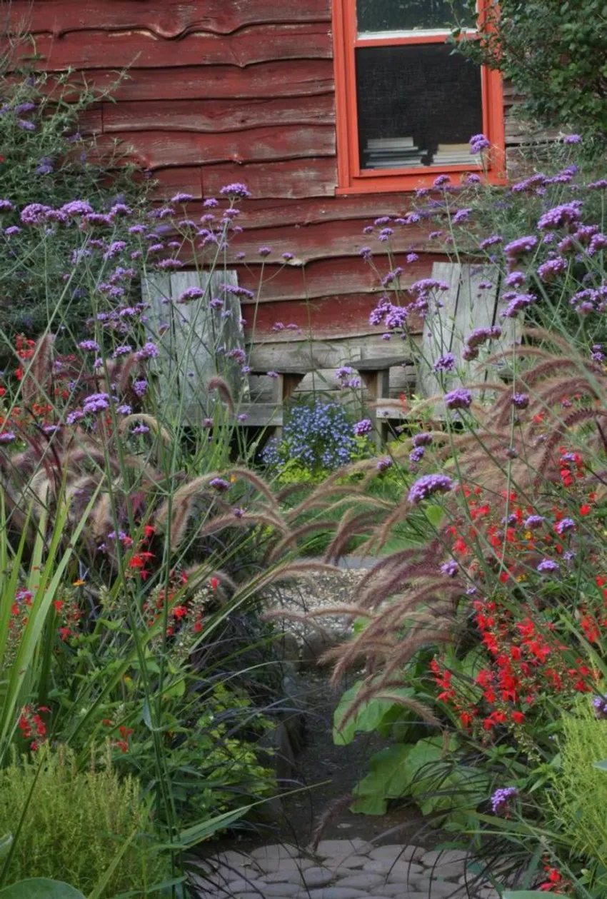 secluded garden seating area, narrow garden path, self-sown plants, lush informal planting, Dean Riddle garden, Catskills New York